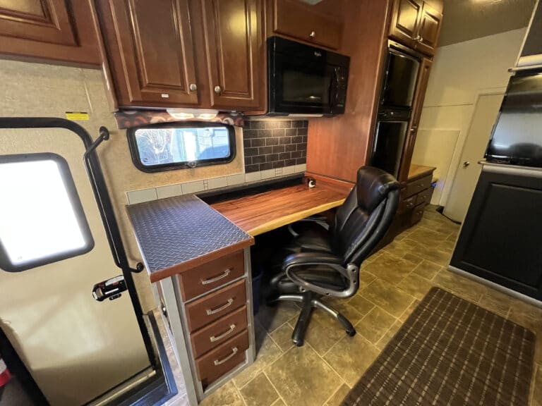 motor coach interior with chair, furnitures, and appliances